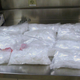 This undated photo provided by US Customs and Border Protection shows 12 packages of methamphetamine that were confiscated from a US citizen after a border patrol agent spotted a remote-controlled drone swooping over the border fence August 8, 2017 at a border crossing near San Diego (via AP)